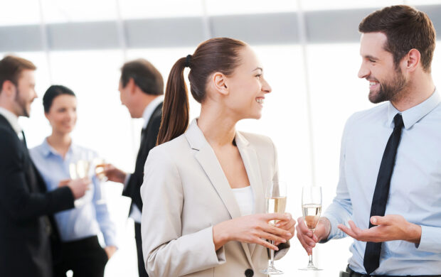 A group of individuals enjoying beverages at an event.